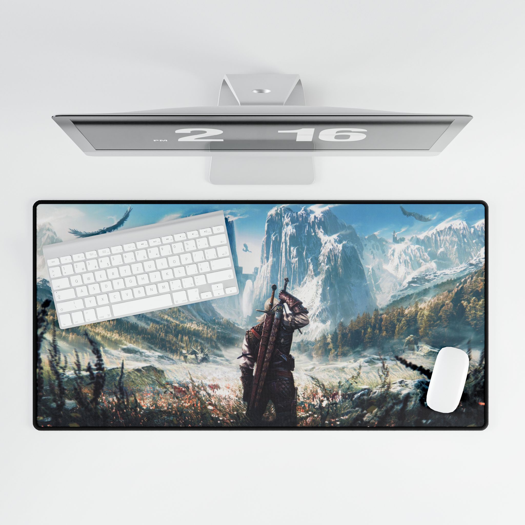 Large Witcher mouse pad protecting a wooden desk surface