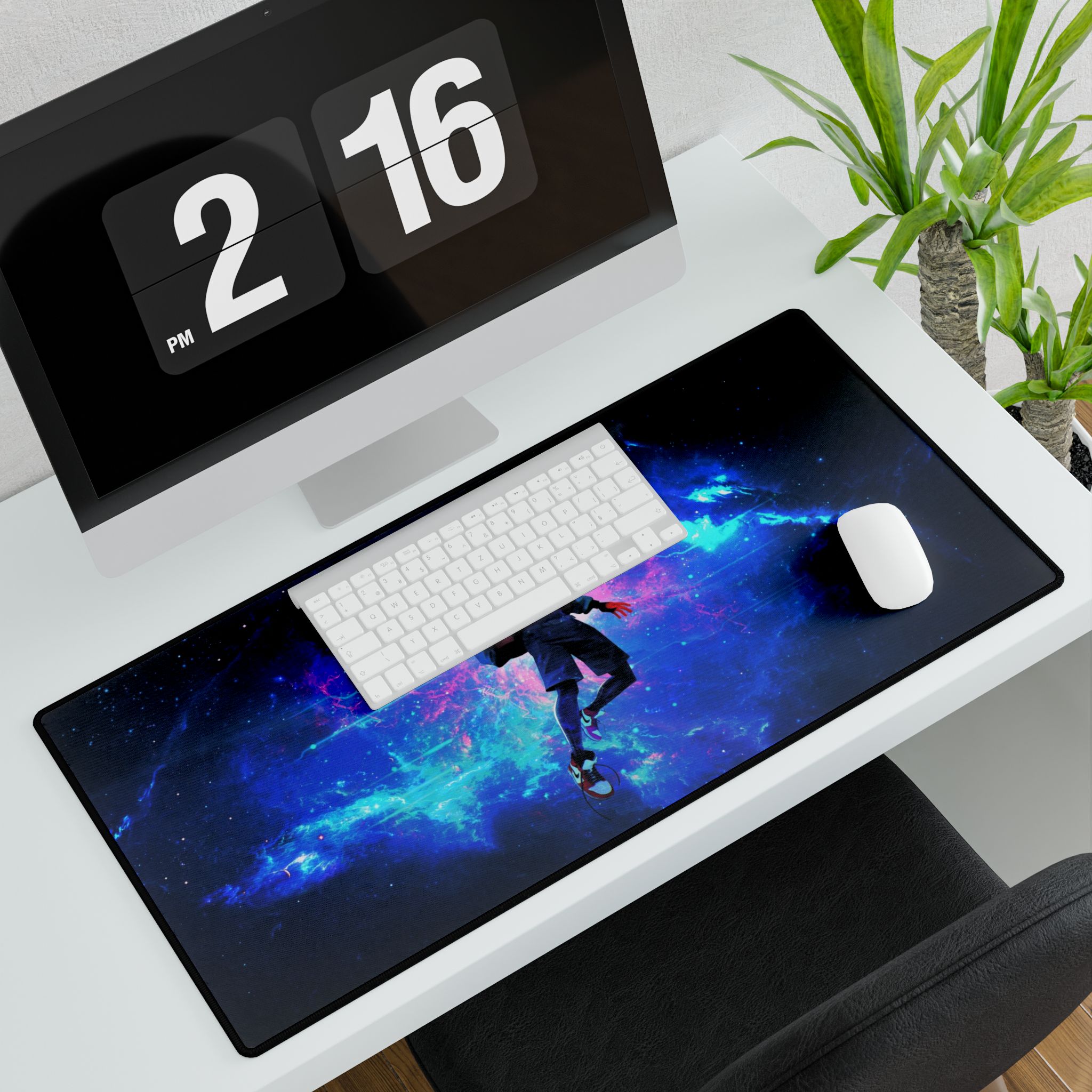 Spiderman desk mat on a desk with a gaming mouse